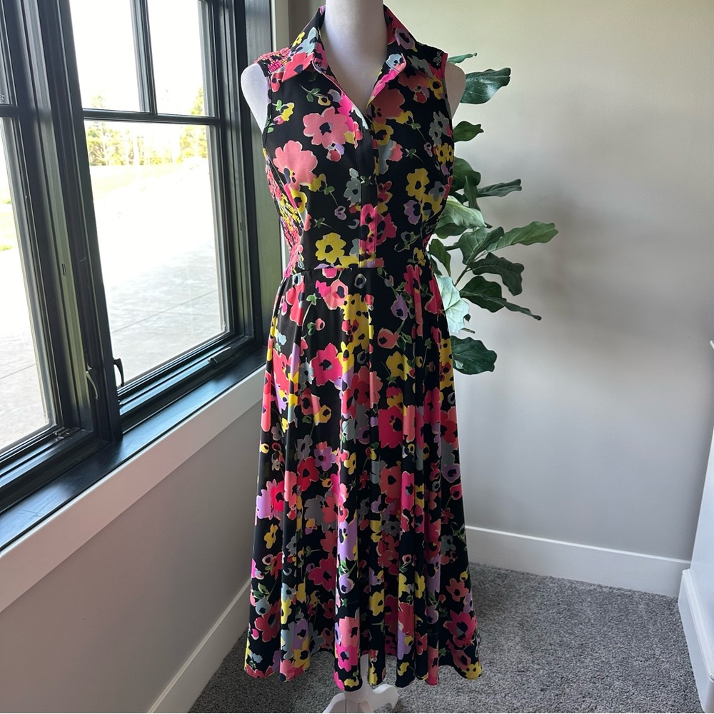 Kate spade size 4. Like new. Asymmetrical hem line.
